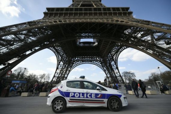 A police car is parked near the Eiffel tower, on March 22, 2016 in Paris. / AFP / LIONEL BONAVENTURE (Photo credit should read LIONEL BONAVENTURE/AFP/Getty Images)